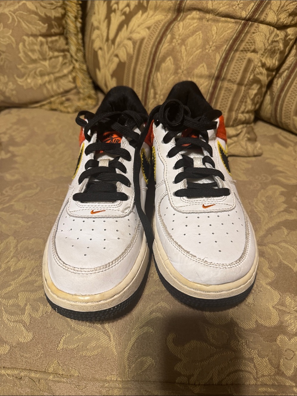 Nike Kids White Low-Top Sneakers with Black and Orange Accents